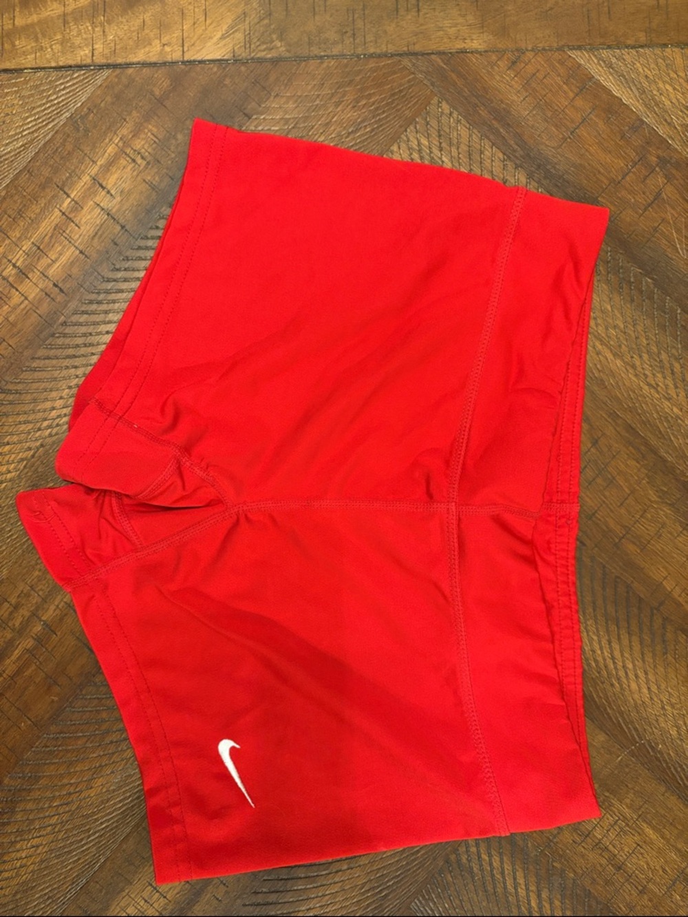 Red Nike dri-fit spandex shorts